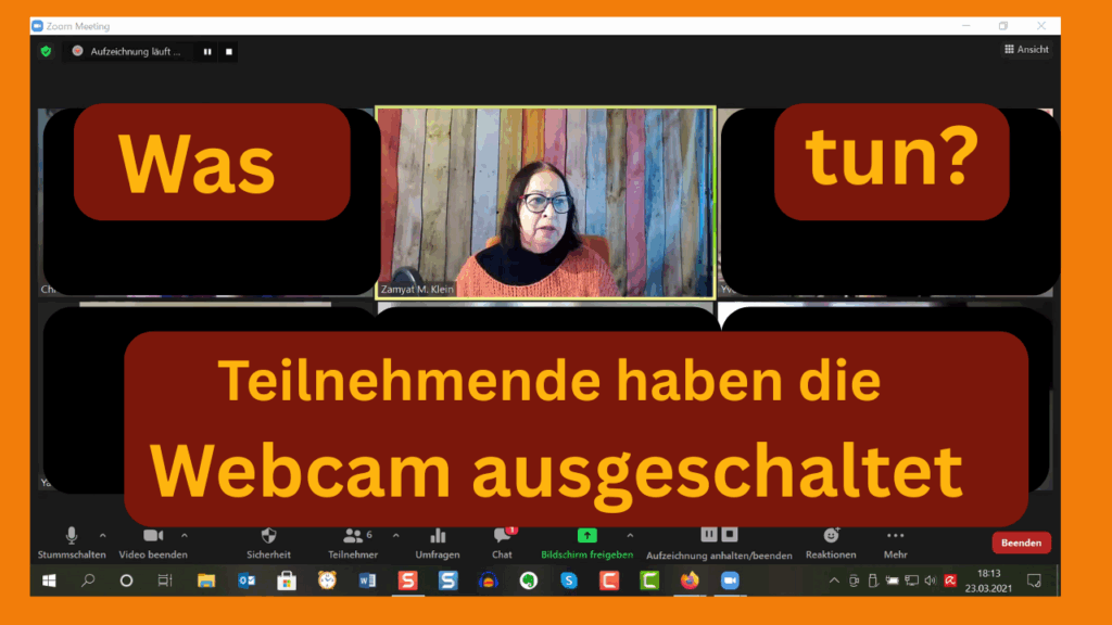 Zamyat umgeben von schwarzen Zoom-Kacheln. Text darauf: Was tun?
